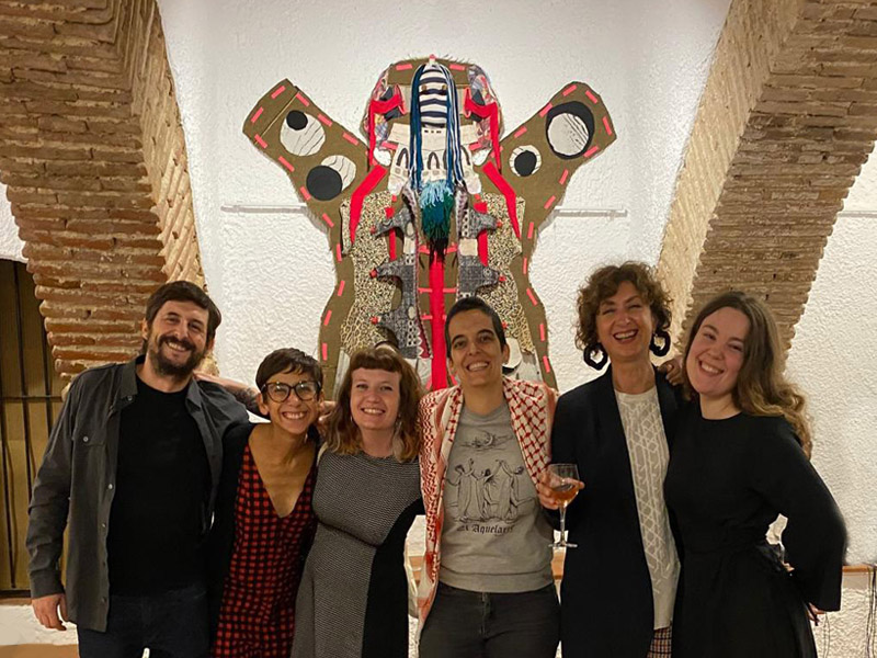 Roser de Foc art residency 2025, a photo of the residents and the founders of the residency in the historical stables in Vinyols, Catalonia